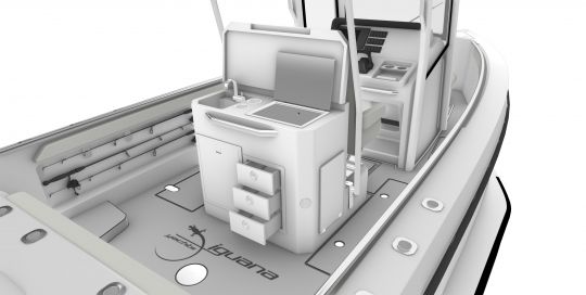 La kitchenette équipée pour la pêche et les rangements de cannes à pêche dans les pavois
